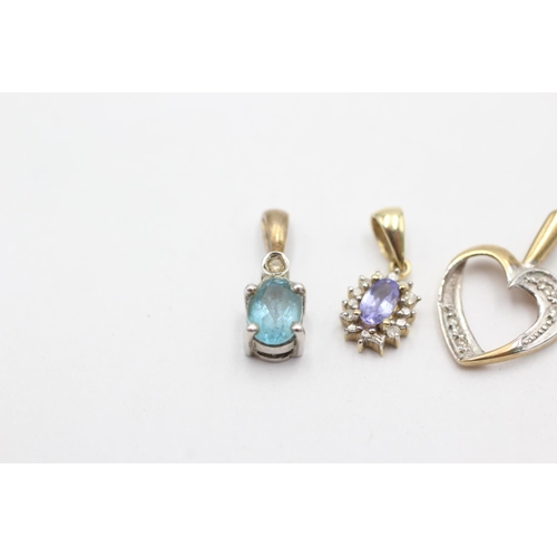 1012 - Three 9ct gold diamond pendants, one topaz, one tanzanite and one heart shaped - approx. gross weigh... 