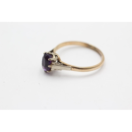 1019 - A 9ct gold amethyst cathedral setting dress ring, size O½ - approx. gross weight 1.8 grams