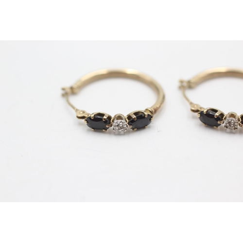 1021 - A pair of 9ct gold sapphire hoop earrings - approx. gross weight 1.2 grams