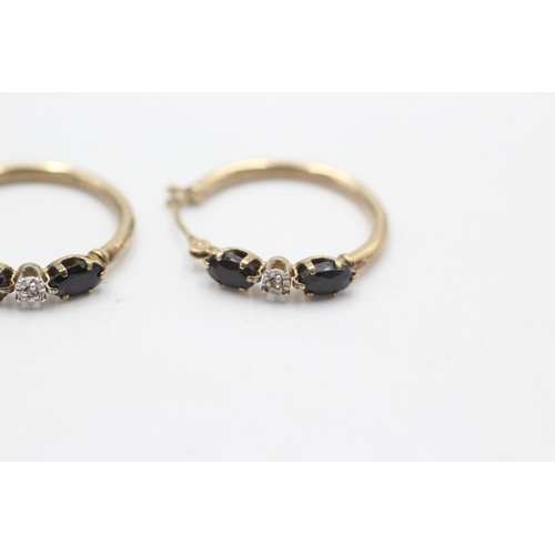 1021 - A pair of 9ct gold sapphire hoop earrings - approx. gross weight 1.2 grams