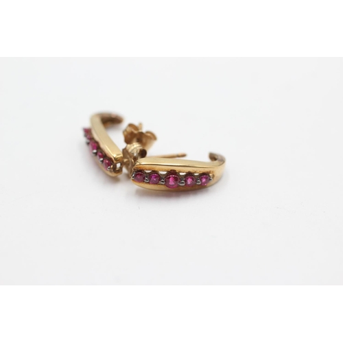 1026 - A pair of 9ct gold ruby half-hoop earrings - approx. gross weight 1.9 grams