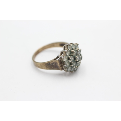 1035 - A 9ct gold clear gemstone starburst cluster ring, size M - approx. gross weight 3.8 grams