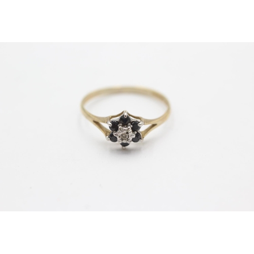 1036 - A 9ct gold diamond and sapphire split shoulders ring, size N½ - approx. gross weight 1.1 grams