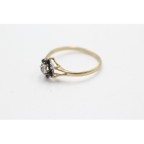 1036 - A 9ct gold diamond and sapphire split shoulders ring, size N½ - approx. gross weight 1.1 grams