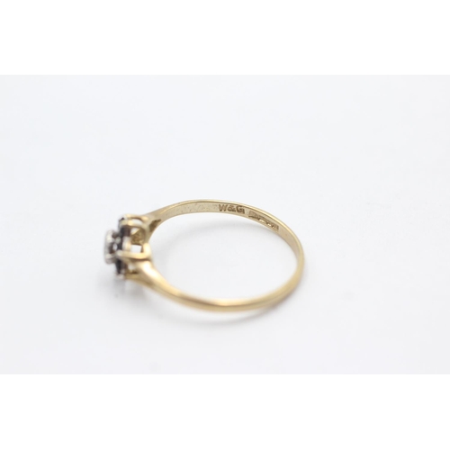 1036 - A 9ct gold diamond and sapphire split shoulders ring, size N½ - approx. gross weight 1.1 grams