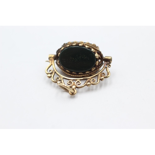 1039 - A 9ct gold bloodstone, onyx and carnelian spinner fob pendant - approx. gross weight 5.1 grams