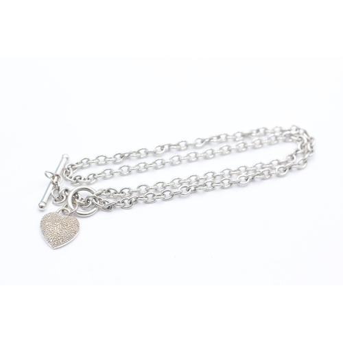 1040 - A 9ct white gold diamond set heart T-bar necklace - approx. gross weight 7.3 grams