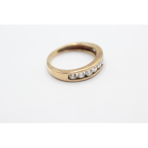 1050 - A 9ct gold clear gemstone half-eternity ring, size L - approx. gross weight 2.6 grams