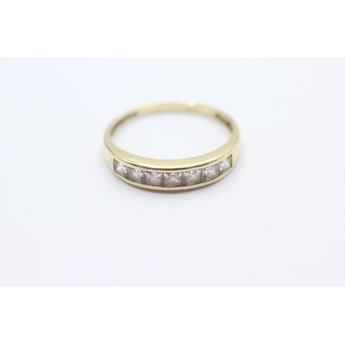 1053 - A 9ct gold clear gemstone channel setting ring, size T - approx. gross weight 2.6 grams