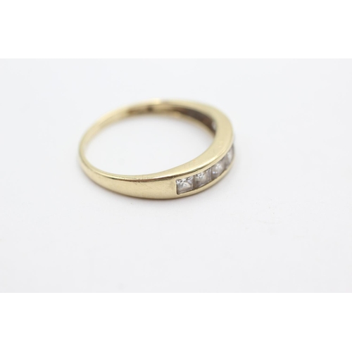 1053 - A 9ct gold clear gemstone channel setting ring, size T - approx. gross weight 2.6 grams