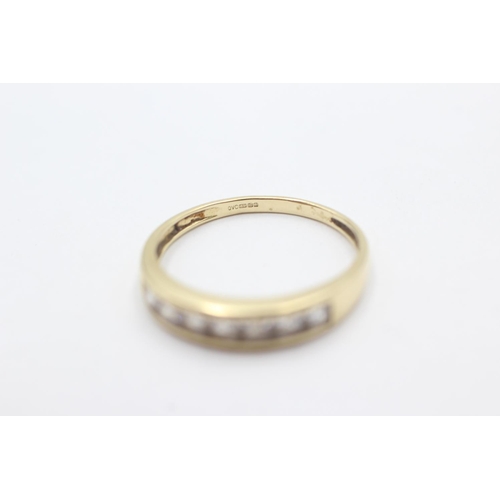 1053 - A 9ct gold clear gemstone channel setting ring, size T - approx. gross weight 2.6 grams