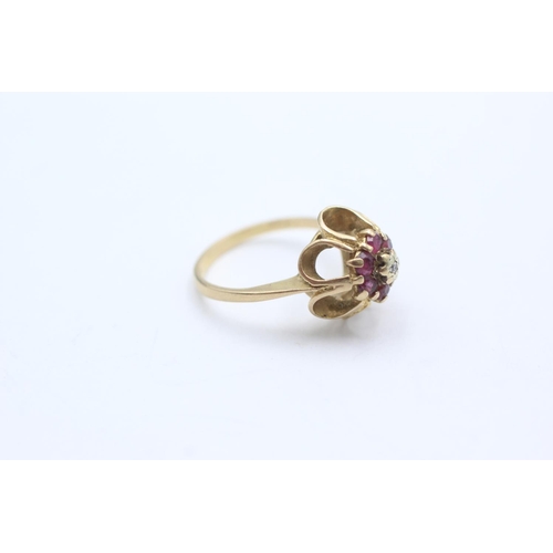 1054 - A 9ct gold diamond and ruby buttercup setting ring, size K - approx. gross weight 2.5 grams