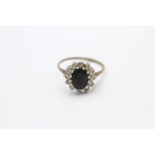 1056 - A 9ct gold sapphire and clear gemstone halo dress ring, size N - approx. gross weight 1.9 grams