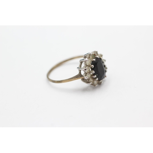 1056 - A 9ct gold sapphire and clear gemstone halo dress ring, size N - approx. gross weight 1.9 grams