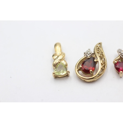 1057 - Four 9ct gold pendants, one opal, one garnet and diamond, one synthetic ruby and diamond and one syn... 