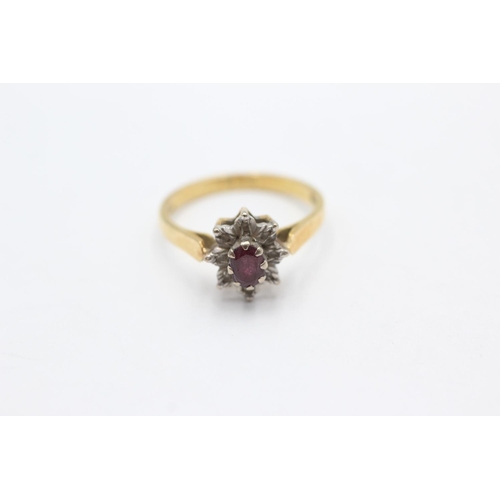 1066 - A 18ct gold ruby and diamond star cluster ring, size N - approx. gross weight 3.4 grams