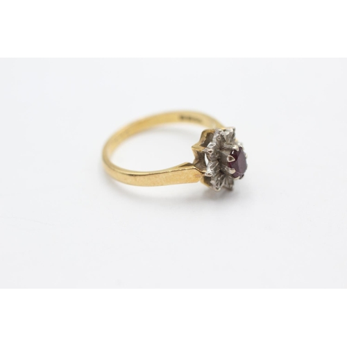 1066 - A 18ct gold ruby and diamond star cluster ring, size N - approx. gross weight 3.4 grams