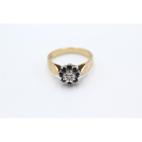 1067 - A 9ct gold diamond and sapphire floral cluster ring, size O - approx. gross weight 3.4 grams