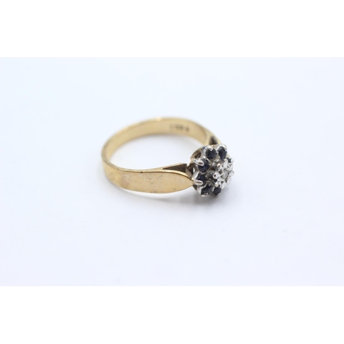 1067 - A 9ct gold diamond and sapphire floral cluster ring, size O - approx. gross weight 3.4 grams