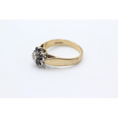 1067 - A 9ct gold diamond and sapphire floral cluster ring, size O - approx. gross weight 3.4 grams