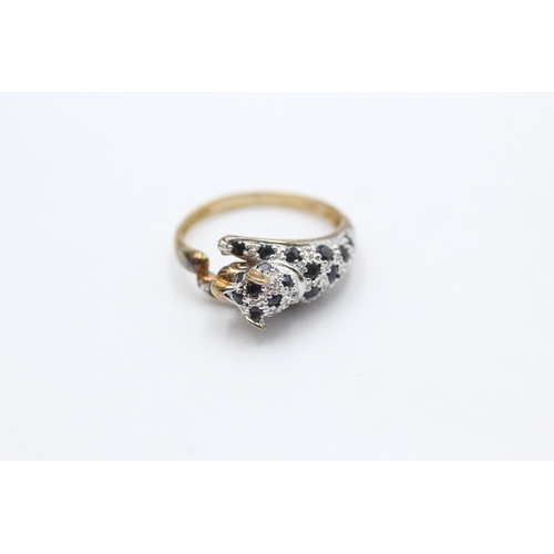 1069 - A 9ct gold diamond and sapphire set panther ring, size P½ - approx. gross weight 2.8 grams