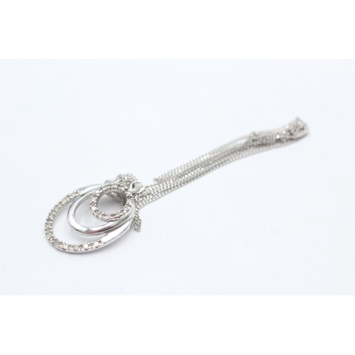 1070 - A 9ct white gold diamond double circle pendant necklace - approx. gross weight 2.4 grams