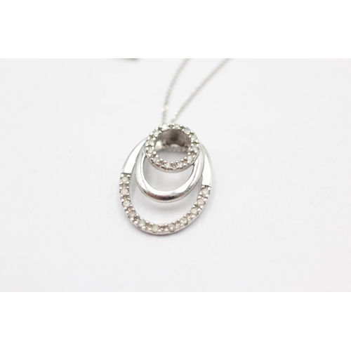 1070 - A 9ct white gold diamond double circle pendant necklace - approx. gross weight 2.4 grams