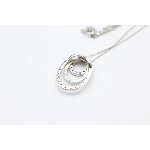 1070 - A 9ct white gold diamond double circle pendant necklace - approx. gross weight 2.4 grams