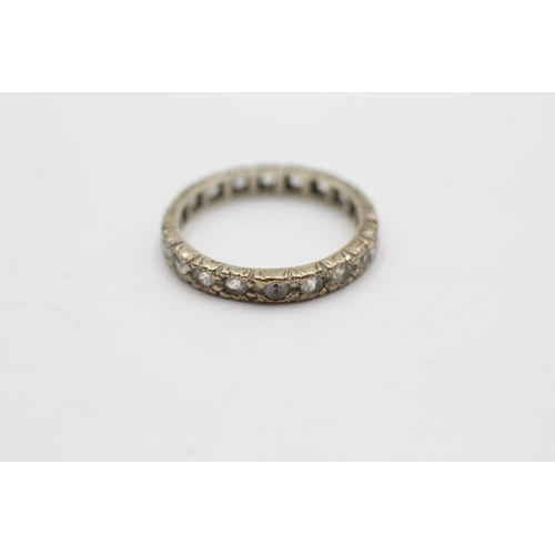 1073 - A 9ct white gold synthetic spinel eternity ring, size J - approx. gross weight 1.9 grams