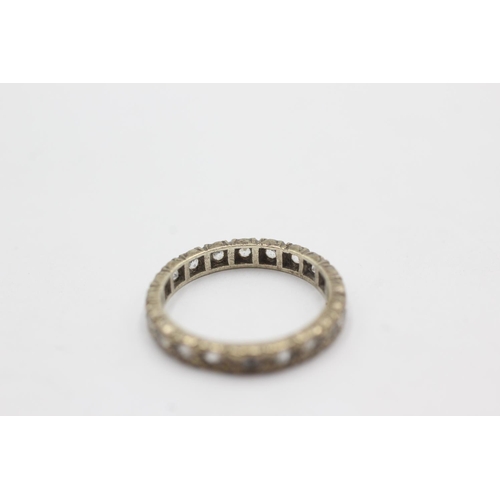 1073 - A 9ct white gold synthetic spinel eternity ring, size J - approx. gross weight 1.9 grams