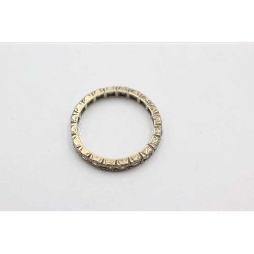 1073 - A 9ct white gold synthetic spinel eternity ring, size J - approx. gross weight 1.9 grams