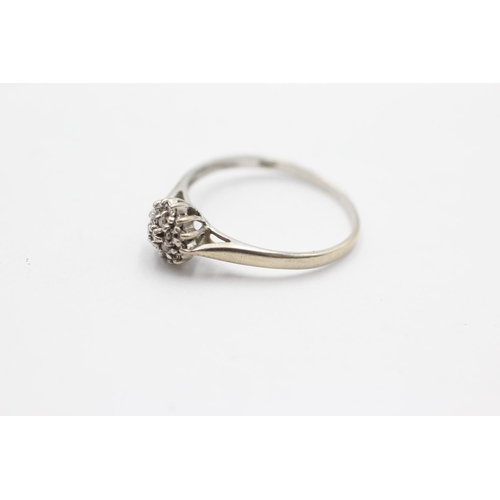 1074 - A 9ct white gold diamond cluster ring, size O - approx. gross weight 1.3 grams