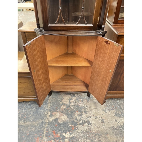 27 - A Strongbow Furniture Regency style mahogany freestanding corner cabinet