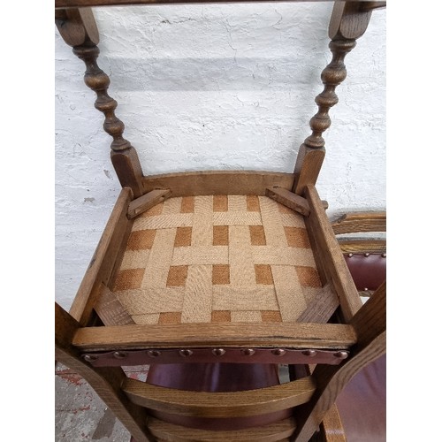 67 - Four Old Charm Cromwellian style oak and burgundy leatherette dining chairs