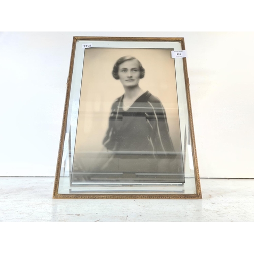 483 - An early 20th century brass and bevelled glass photo frame - approx. 37.5cm high x 27.5cm wide