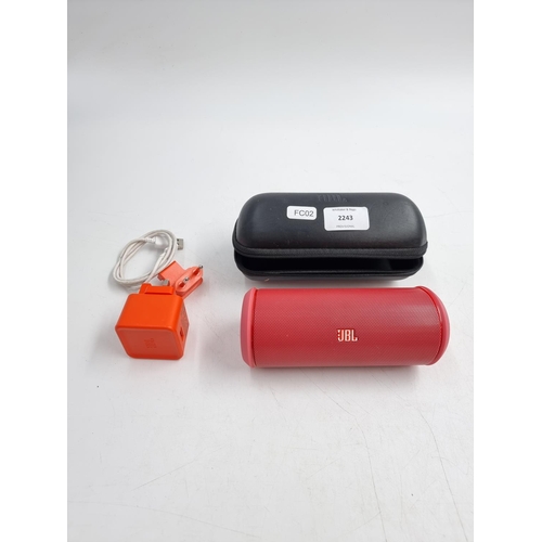 692 - A cased JBL Flip 2 wireless speaker