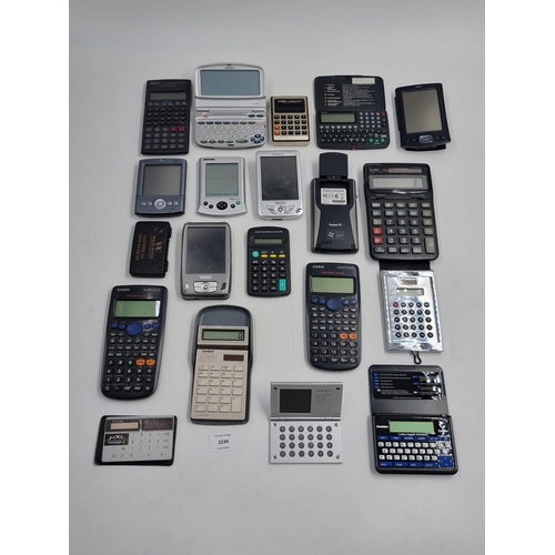 714 - A collection of handheld electronic devices to include pocket calculators, pocket PCs, organisers et... 