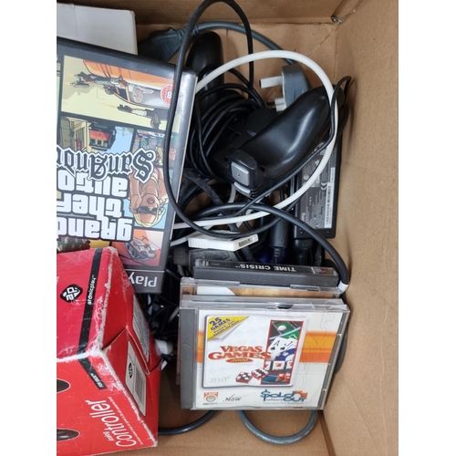 731 - A box containing various video games, empty game boxes and accessories