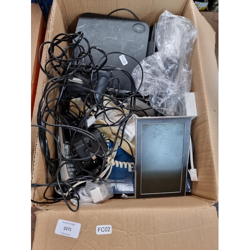 756 - A box containing electrical items to include landline phones, digital photo frames etc.