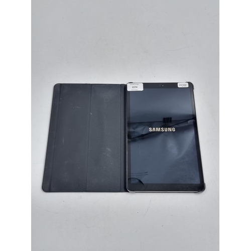 742 - A Samsung Galaxy Tab A SM-T590 (2018) with charging cable and official Samsung flip case