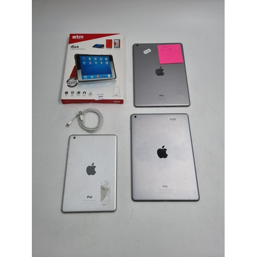 743 - Three Apple iPads, one A1822, one A1474 and one A1489