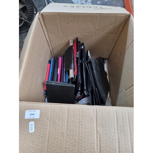 754 - A box containing tablet cases