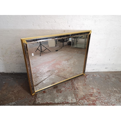 156 - A 19th century style gilt and mottled glass framed bevelled edge wall mirror - approx. 126cm wide x ... 