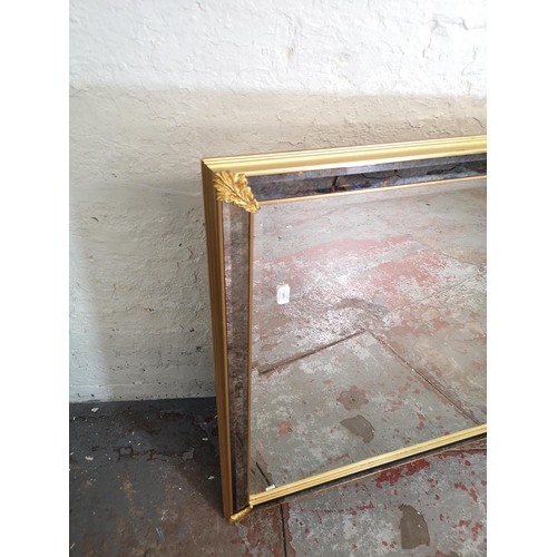 156 - A 19th century style gilt and mottled glass framed bevelled edge wall mirror - approx. 126cm wide x ... 