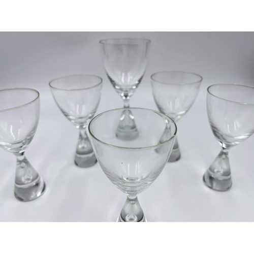 216 - Seven pieces of mid 20th century studio glass, six Swedish Holmegaard teardrop drinking glasses and ... 