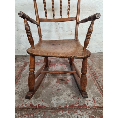 102 - A 19th century elm and beech child's rocking chair