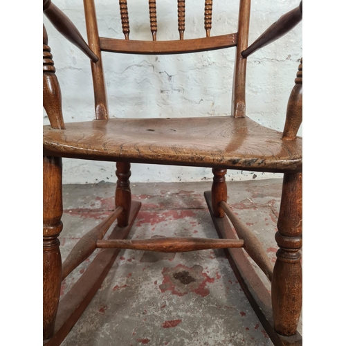 102 - A 19th century elm and beech child's rocking chair