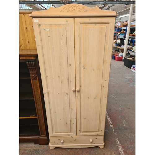 11 - A modern painted pine double wardrobe with lower drawer - approx. 190cm high x 54cm wide x 52cm deep