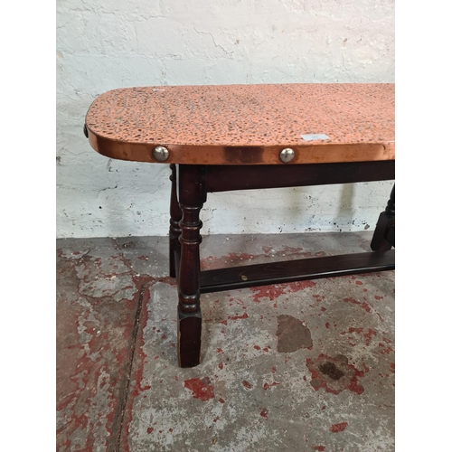 111 - A beech and copper topped coffee table