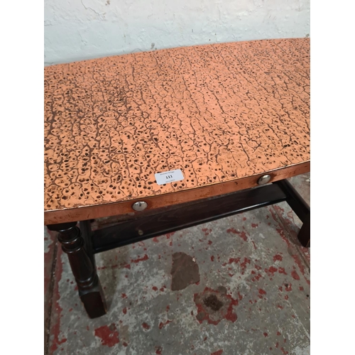 111 - A beech and copper topped coffee table